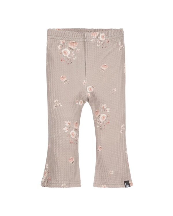 Babystylingin ihanat leveälaheiset housut tytölle, sävyssä light.